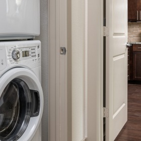 Washer and Dryer  Large full size washer in dryer adjacent to the kitchen